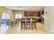 Kitchen featuring an island with seating that flows into a dining room and has stainless steel appliances at 8124 115Th E Ave, Parrish, FL 34219