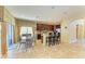 Kitchen island with seating and dining area with access to the outdoor space at 8124 115Th E Ave, Parrish, FL 34219