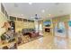 Bright living room featuring a fireplace, tile flooring, ceiling fan, and comfortable leather seating at 8124 115Th E Ave, Parrish, FL 34219