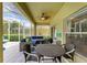 Inviting outdoor patio with cozy seating area and ceiling fan, perfect for relaxation at 8124 115Th E Ave, Parrish, FL 34219