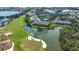 Scenic aerial view of waterfront condos nestled on a golf course at 8951 Veranda Way # 621, Sarasota, FL 34238