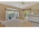 Bright bedroom with floral wallpaper, carpet, a bay window with bench seating and a mirrored dresser at 8951 Veranda Way # 621, Sarasota, FL 34238