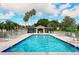 Beautiful community pool with ample seating and a charming poolside cabana at 8951 Veranda Way # 621, Sarasota, FL 34238