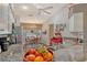Bright kitchen boasts granite counters, stainless steel appliances, wood floors and cozy breakfast nook at 8951 Veranda Way # 621, Sarasota, FL 34238