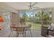 Cozy sunroom with a table and chairs, perfect for enjoying views of the landscaped grounds at 8951 Veranda Way # 621, Sarasota, FL 34238