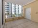 Enjoy this spacious balcony with tile flooring and views of the city at 100 Central Ave # C521, Sarasota, FL 34236