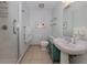 Bathroom featuring a glass-enclosed shower, a modern vanity, and decorative accents at 100 Central Ave # C521, Sarasota, FL 34236