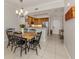 Modern dining area showcasing a stylish table set and an adjacent well-equipped kitchen at 100 Central Ave # C521, Sarasota, FL 34236