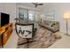 Bright living room featuring stylish furniture, a ceiling fan, and balcony access at 100 Central Ave # C521, Sarasota, FL 34236