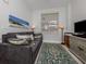 Living room with a gray couch, decorative pillows, area rug, and natural light at 100 Central Ave # C521, Sarasota, FL 34236