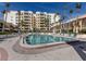 Enjoy this beautiful pool and lounge area with shade and comfortable seating at 100 Central Ave # C521, Sarasota, FL 34236