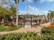 Elegant theater exterior with a manicured lawn, brick walkways, and charming architectural features at 100 Central Ave # C521, Sarasota, FL 34236