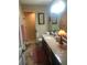 This bathroom boasts a walk-in shower, granite counters, and framed mirror over the sink at 10157 Sunburst Ct, Spring Hill, FL 34608