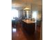 Bright, spacious kitchen with an island, stainless steel appliances, and hardwood floors at 10157 Sunburst Ct, Spring Hill, FL 34608