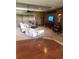 Spacious living room with comfortable seating, neutral carpet, and recessed lighting at 10157 Sunburst Ct, Spring Hill, FL 34608
