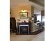 Cozy living room featuring a fireplace, neutral paint, and access to a breakfast bar at 10157 Sunburst Ct, Spring Hill, FL 34608