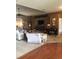 This large living room has neutral carpeting, dark wood accents, and abundant natural light from its windows at 10157 Sunburst Ct, Spring Hill, FL 34608