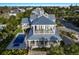 Breathtaking aerial view of home with a pool and multiple decks at 112 50Th St, Holmes Beach, FL 34217