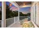 Relaxing balcony with comfortable seating and a beautiful sunset view at 112 50Th St, Holmes Beach, FL 34217