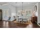 Bright dining room featuring a round table with seating for eight and a decorative chandelier at 112 50Th St, Holmes Beach, FL 34217