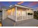 Exterior elevation with a balcony overlooking the outdoor areas of the property at 112 50Th St, Holmes Beach, FL 34217