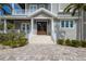 Inviting home featuring double front doors, covered entry and meticulous landscaping at 112 50Th St, Holmes Beach, FL 34217