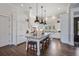 Spacious kitchen features a large island, granite countertops, and stainless steel appliances at 112 50Th St, Holmes Beach, FL 34217