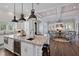 Gourmet kitchen with large center island and adjacent living area, perfect for entertaining at 112 50Th St, Holmes Beach, FL 34217
