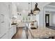 Well-equipped kitchen features custom cabinetry, granite countertops, and stainless appliances at 112 50Th St, Holmes Beach, FL 34217