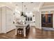 Modern kitchen with a large center island, sleek countertops, and pendant lighting at 112 50Th St, Holmes Beach, FL 34217