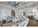 Open-concept living room with coffered ceilings, seamlessly connecting to the kitchen at 112 50Th St, Holmes Beach, FL 34217