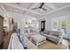 Bright and airy living room boasts coffered ceilings and an open layout at 112 50Th St, Holmes Beach, FL 34217