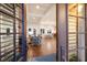 Grand open-concept living and dining area with hardwood floors, coffered ceilings, and plenty of natural light at 112 50Th St, Holmes Beach, FL 34217