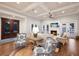 Inviting living room with stylish decor, fireplace, wood floors, and beautiful ceiling at 112 50Th St, Holmes Beach, FL 34217
