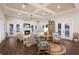 Bright living room with a fireplace, ceiling fan, wood floors and lots of natural light at 112 50Th St, Holmes Beach, FL 34217