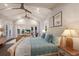 Comfortable main bedroom with vaulted ceilings, sitting area, and lots of natural light at 112 50Th St, Holmes Beach, FL 34217