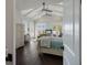 Spacious main bedroom featuring vaulted ceilings, a seating area, and access to a private balcony at 112 50Th St, Holmes Beach, FL 34217