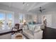 Beautiful main bedroom with a vaulted ceiling, lounge area and balcony access at 112 50Th St, Holmes Beach, FL 34217