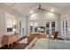 Inviting main bedroom with a vaulted ceiling, large windows, and comfortable seating area at 112 50Th St, Holmes Beach, FL 34217