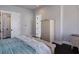 Inviting main bedroom with wicker accents, a plush bed, and ample natural light at 112 50Th St, Holmes Beach, FL 34217