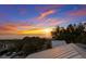 Breathtaking sunset ocean view showing rooftop, beach and ocean with a serene atmosphere and a vibrant sky at 112 50Th St, Holmes Beach, FL 34217