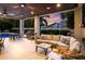Inviting outdoor living space featuring comfortable seating, a dining area, and grill, ideal for entertaining guests at 112 50Th St, Holmes Beach, FL 34217