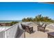 Rooftop deck with outdoor furniture and amazing ocean views creating an inviting outdoor space at 112 50Th St, Holmes Beach, FL 34217