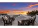 Cozy rooftop seating area providing stunning ocean views, perfect for relaxation and enjoying the sunset at 112 50Th St, Holmes Beach, FL 34217