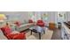 Sitting room furnished with comfortable couches, accent chair, and decorative pillows at 112 50Th St, Holmes Beach, FL 34217