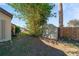 The backyard shows a utility shed, mature trees, and partial fencing at 1224 Inverness St, Port Charlotte, FL 33952