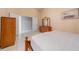 Neutral bedroom with tile floors and views of a closet and art, offering plenty of space at 1224 Inverness St, Port Charlotte, FL 33952