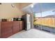 Kitchen boasts stainless steel refrigerator and convenient outdoor access through a sliding glass door at 1224 Inverness St, Port Charlotte, FL 33952
