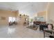 Bright living room with tile floors, neutral walls, ceiling fan, and access to other rooms at 1224 Inverness St, Port Charlotte, FL 33952