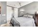 Bedroom featuring a bed with metal frame and two white doors with dark trim at 12245 Marsh Pointe Rd, Sarasota, FL 34238